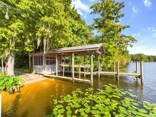 Building Photo - Private Furnished Riverfront Estate with Dock & Guest Apartment