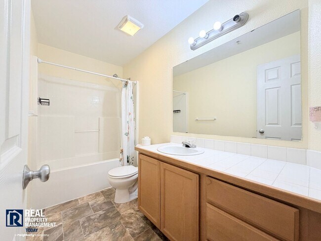 Building Photo - Spacious 4-Bedroom Townhome in Alicia Meadows | Garage, Patio & Pet Friendly