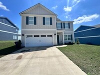 Building Photo - efficient two-level home provides a large living room, 4 very spacious bedrooms, and 2.5 bathrooms