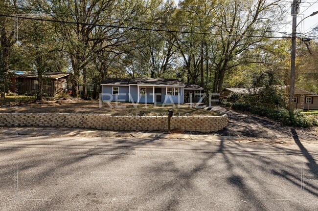 Building Photo - 3 BR 2 BA Home with Fenced Yard & Carport