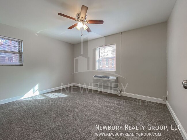 Building Photo - Modern One-Bedroom Apartment in Port Vue: ...