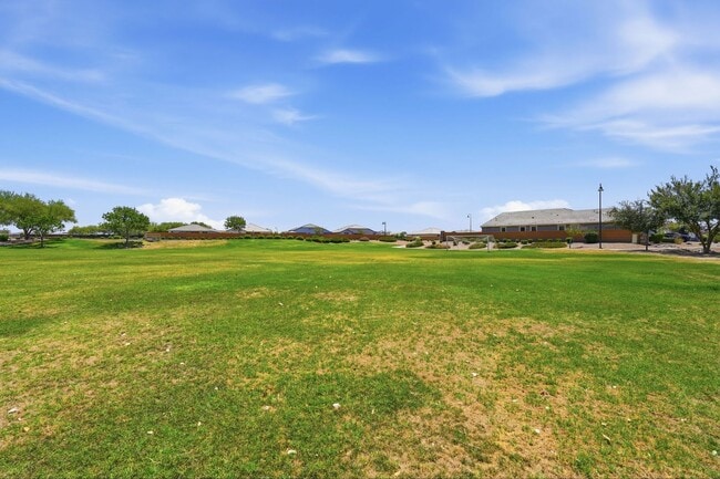 Building Photo - Spacious 5-Bedroom Home with Open Floor Plan & Private Backyard