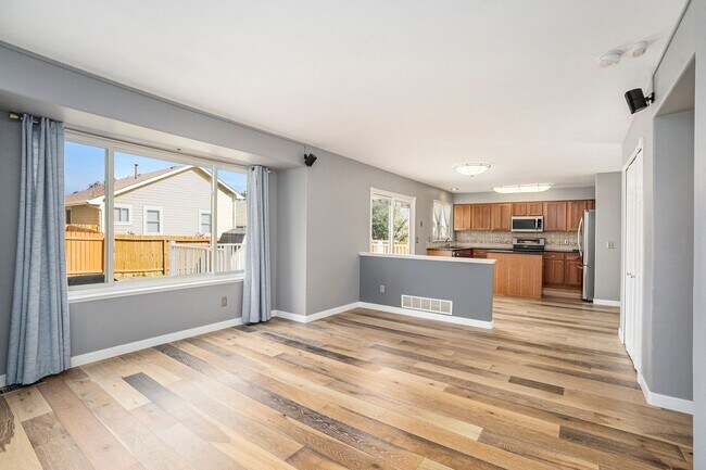 Building Photo - Spacious 4-Bedroom Home in District 20 with Huge Deck & Fenced Yard