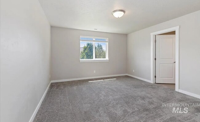 Building Photo - Stunning 4-Bedroom Home with Privacy & Low-Maintenance Living in Verado