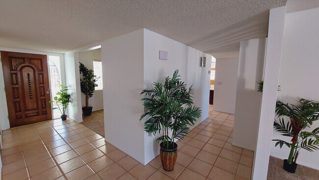 Hall runs from living areas to bedrooms - 5161 E Camino Bosque