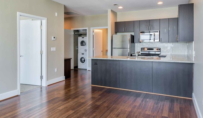 Spacious floor plans with wood flooring throughout - Southstar Lofts