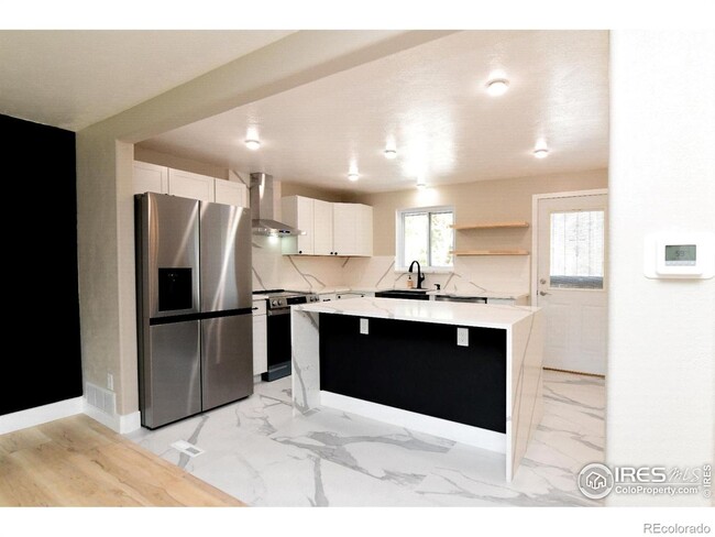 Building Photo - Remodeled home with separate finished base...