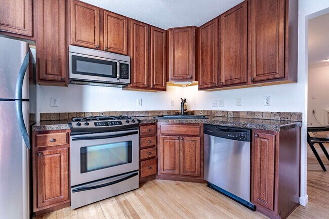 Building Photo - Stylish 2BR/2BA Condo with Patio & Parking...