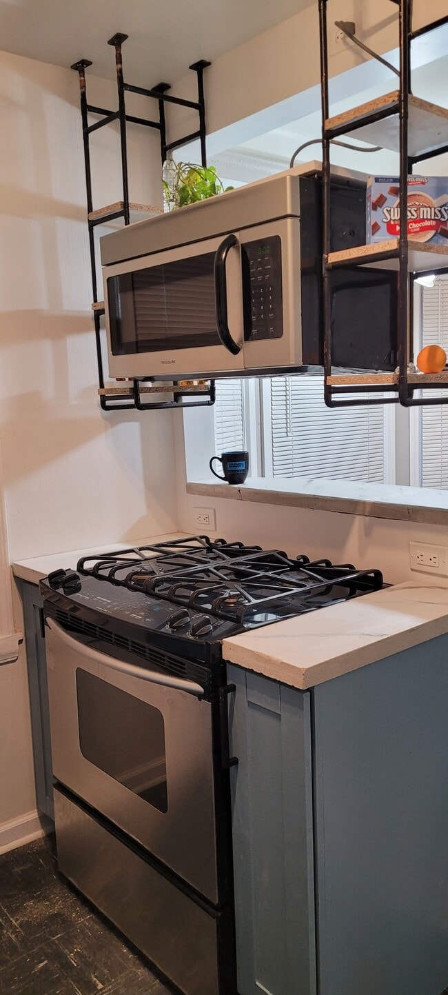 slide in gas stove and suspended Microwave - 19928 Ashton Ave