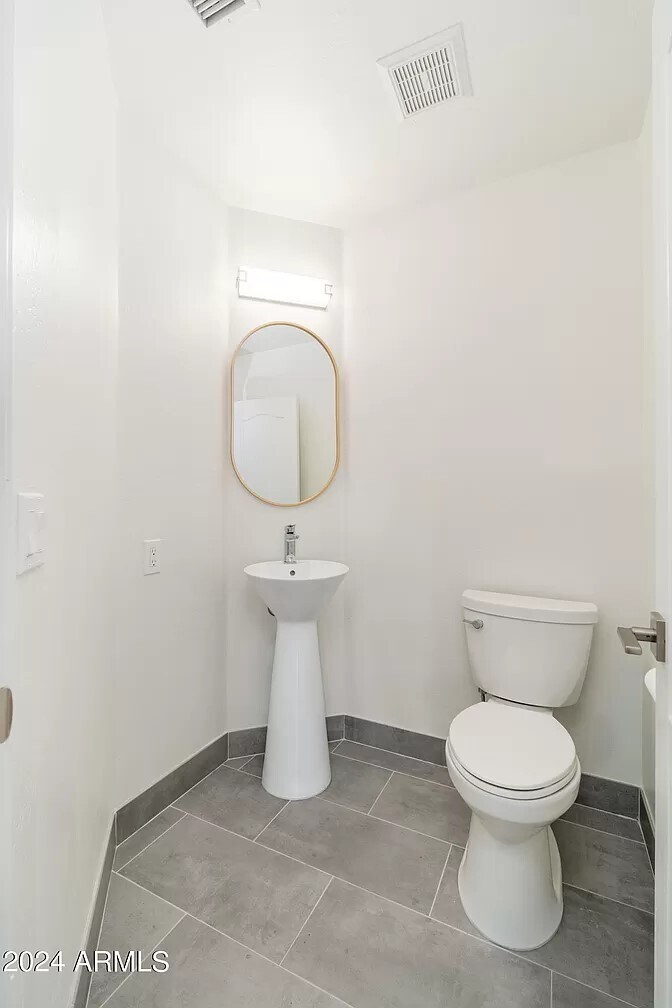 Downstairs half bath - 6739 E Gelding Dr