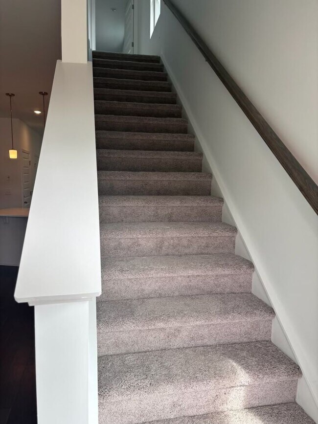 Building Photo - **BE THE LUCKY ONE TO LIVE IN THIS 2024-BUILT END-UNIT TOWNHOME IN A RESORT-STYLE COMMUNITY**