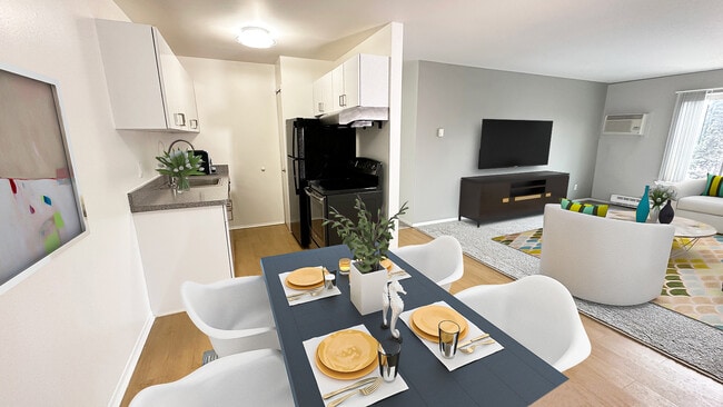 White sleek cabinets, stainless or black appliances, wood plank floors. - Metropolitan Lafayette Flats