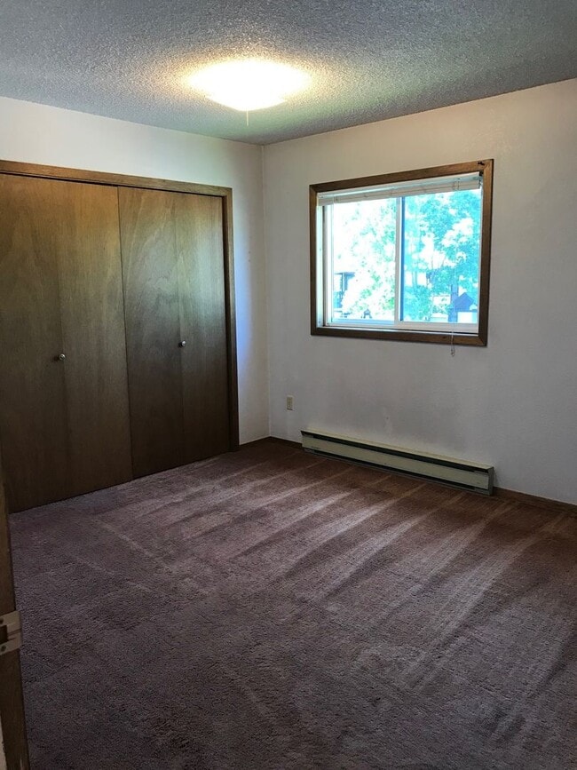 Building Photo - Charming 2-Bedroom Condo Near MSU – Pet Friendly- NEW LOW PRICE