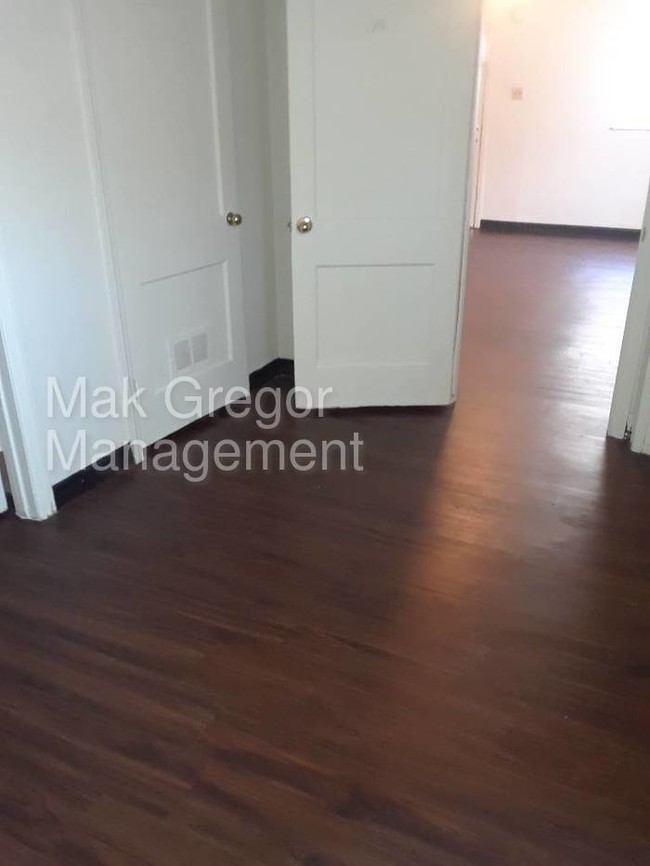 Building Photo - New Flooring, Fresh Paint, Appliances, A/C.