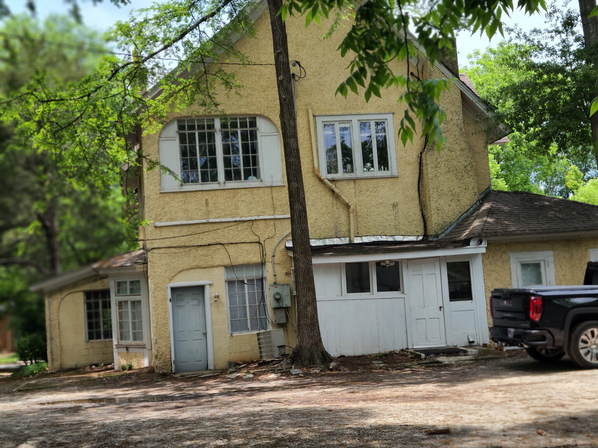 big house on property, unit is in backyard - 145 Mell St