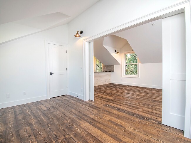 Building Photo - Expansive Loft-Style Carriage House in Private Haller Lake Estate