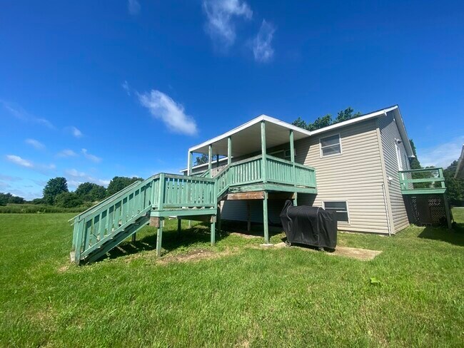 Building Photo - Beautiful secluded 4 bedroom 2.5 bath home with 2 stall detached garage and descent sized yard