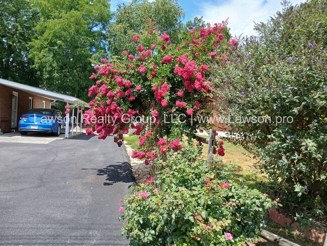 Building Photo - One Level Living- Beautifully Landscaped Yard and Attached Carport
