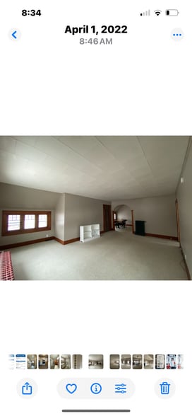 Large living room with partial view of West Bay. - 810 E Front St