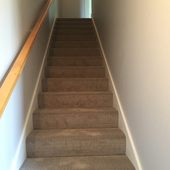 Stairs from kitchen to two bedrooms and bath - 14 Heron Cove Dr