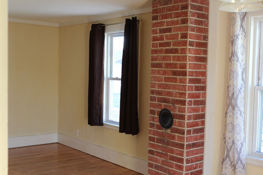Standing in the dining room looking toward the living room. - 1011 Main St