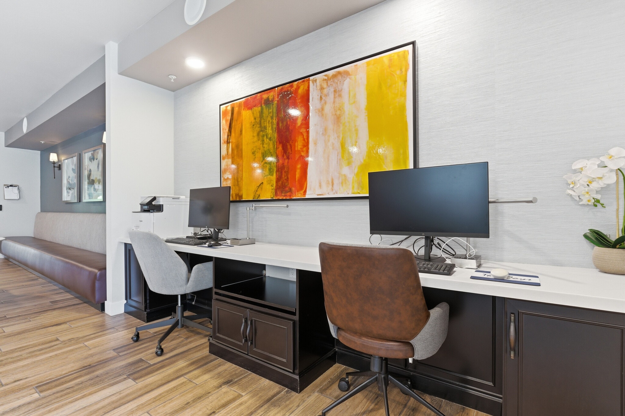 Dedicated business center offering a quiet workspace with multiple computers, monitors, and printer. - 2511 W Queen Creek Rd