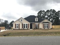 Building Photo - Stylish 4-Bedroom Home with 3-Car Garage a...