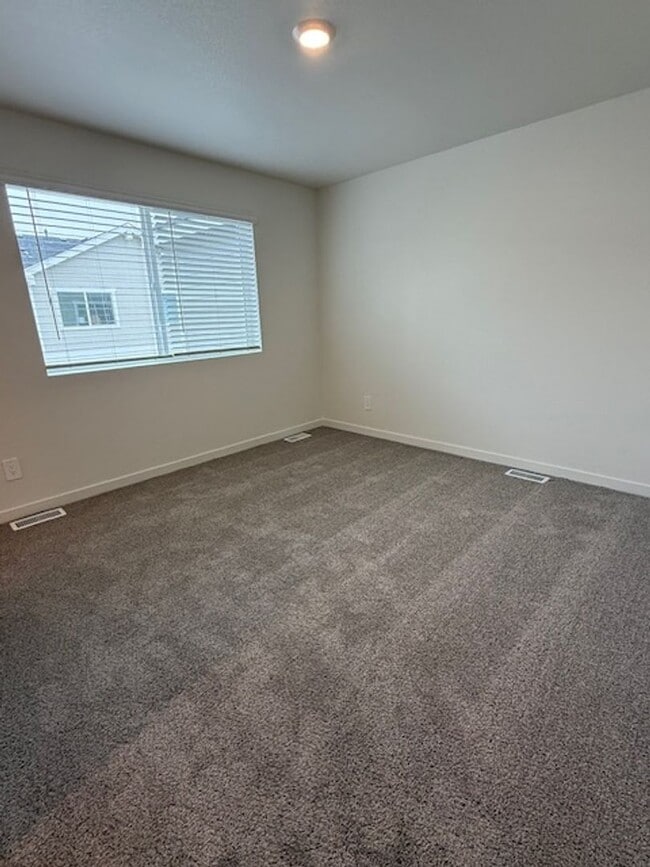 Building Photo - New 2 Bedroom Townhome + 2 Car Garage