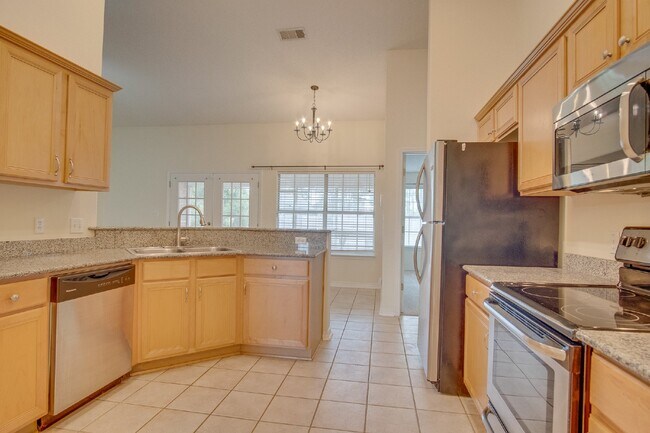 Building Photo - Updated 4BR/3BA Brick Home Near NAS Pensacola with Office & Screened Porch