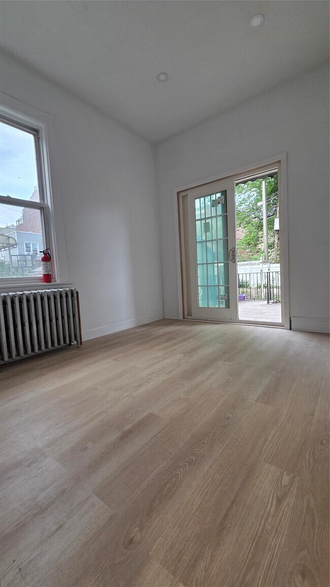 Building Photo - 42-21 65th Pl