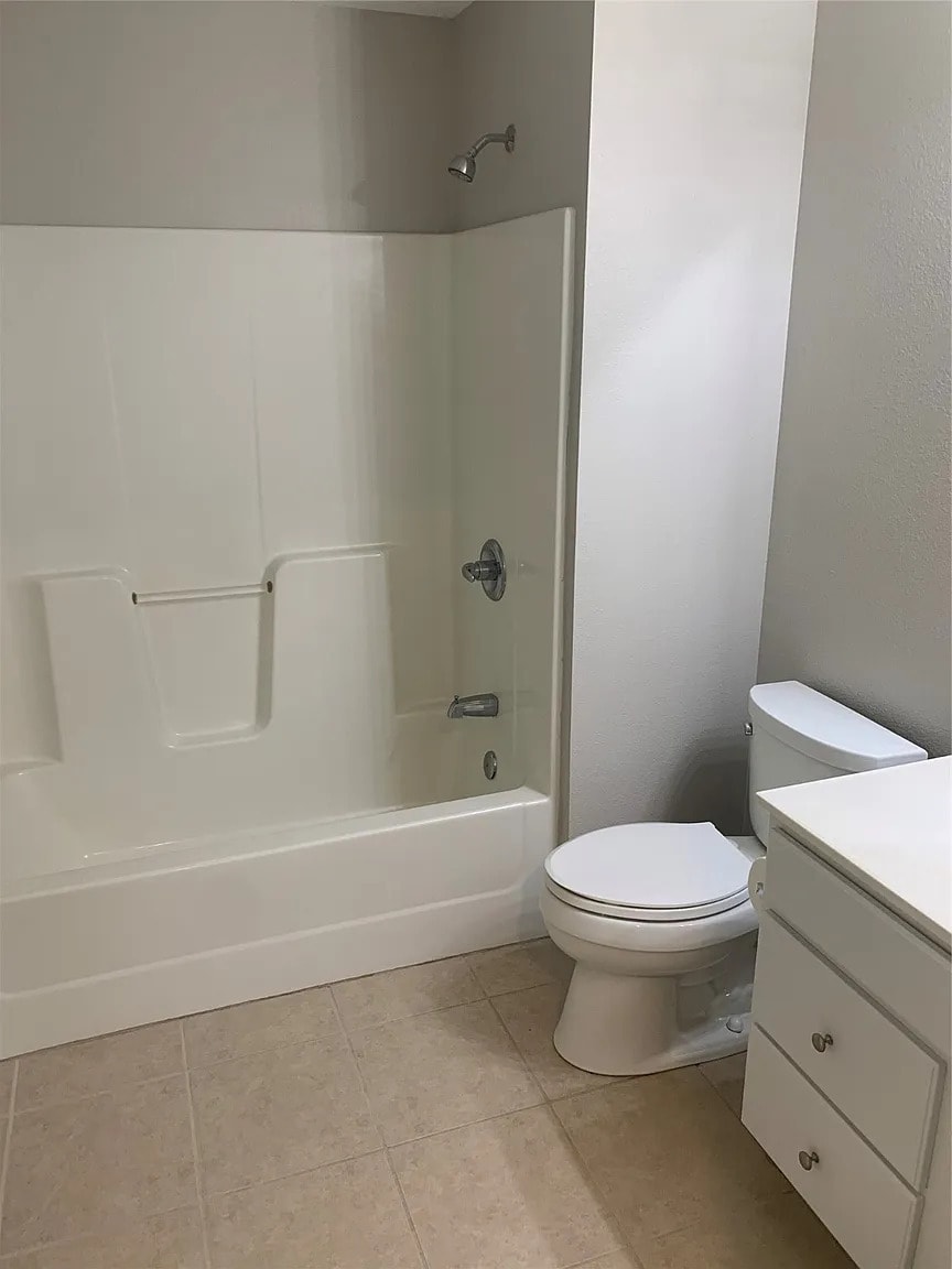 Master bathroom with full shower/tub combo. - 105 NW 8th St
