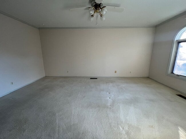 Building Photo - Step into this inviting, sunlit home where space and comfort blend seamlessly