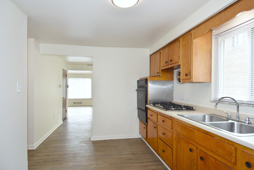 Spacious kitchen with access to dining & living room beyond. - 3156 Glendale Ave