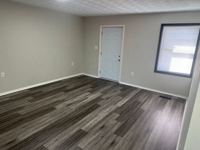 Building Photo - Oversized 3 Bedroom with laundry room!