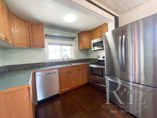 Building Photo - Whimsical Craftsman with Wraparound Porch, Bonus Room & Liberty Bay Peek Views