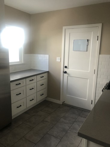 Cabinets near back door of building - 1801 Michigan Ave