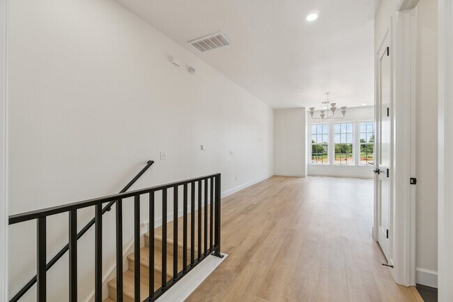 Building Photo - Bright. Clean. Calm. Your Elevated One-Bed...