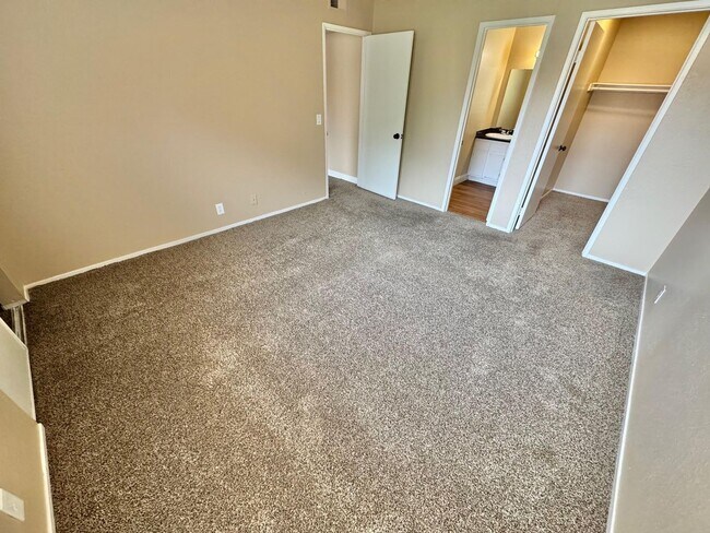 Building Photo - THIS SECOND-FLOOR DESERT SHORES CONDO OFFE...