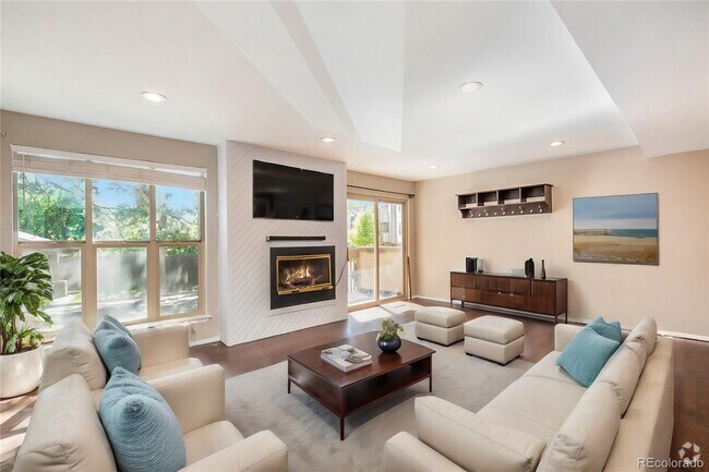 Living room with tons of space and natural light. - 701 Harlan St