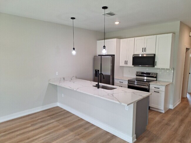 Building Photo - Available with ZERO DEPOSIT MOVE-IN!