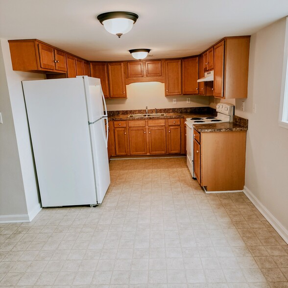 Kitchen opens into dining room with additional pantry/closet - 878 N Base Rd