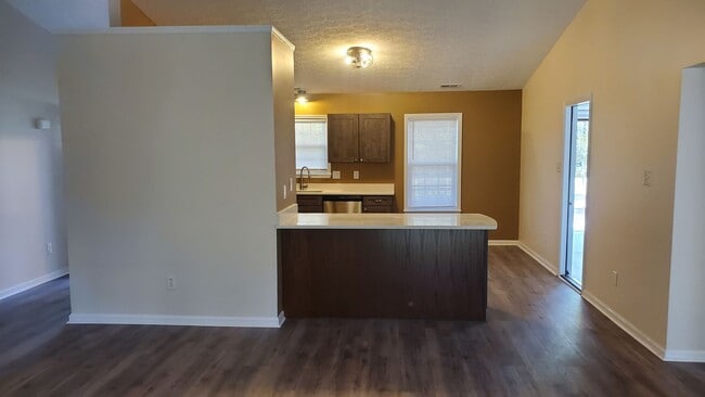 Building Photo - Newly Renovated 3 bedroom, 2 bath unit with fenced in yard and 2 car garage. Recently Reduced to ...