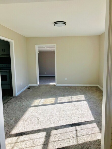 Front room off of kitchen and entry - 9225 Amos Rd