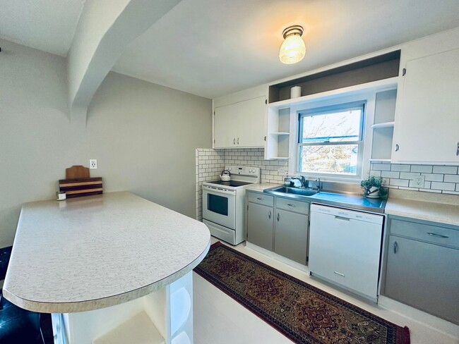 Building Photo - {8520} Charming Four Bedroom in Fantastic Location + Two Main Floor Bedrooms + Hardwood Floors + ...