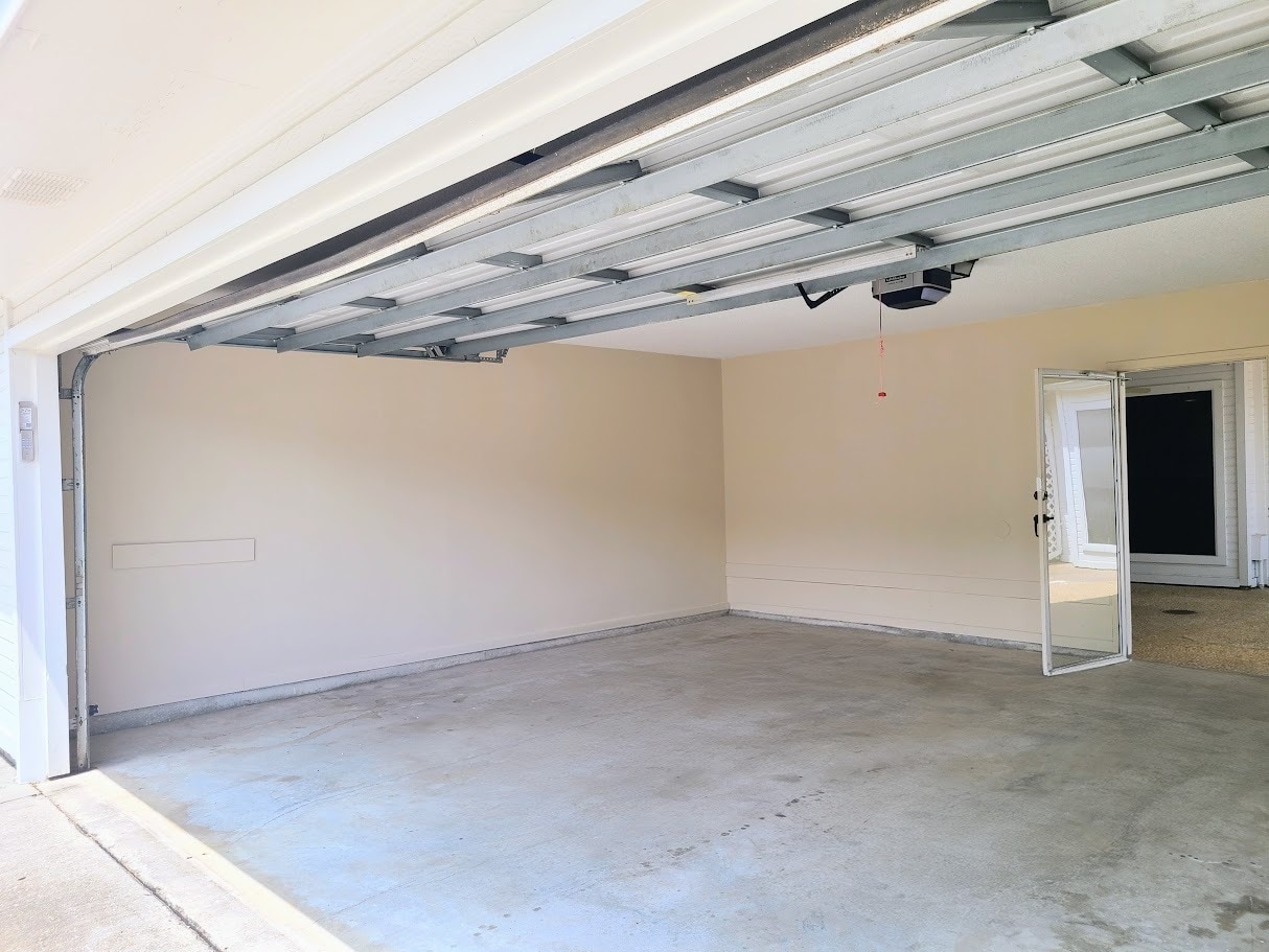 Enclosed 2-car garage with automatic garage door opener - 12439 Coursey Blvd