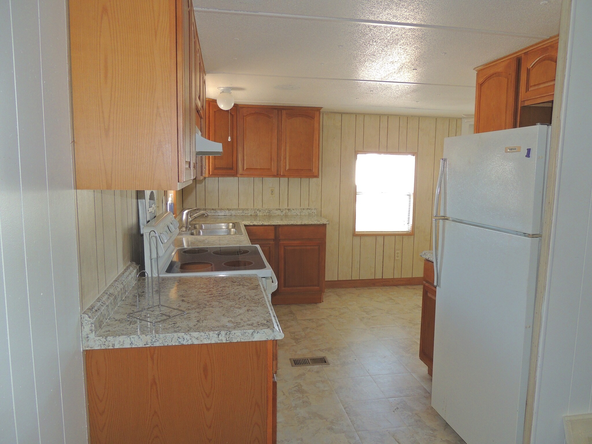 VIEW OF KITCHEN FROM LIVING ROOM - 7424 Egress Ln