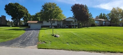 Building Photo - Beautiful home with peek a boo views of West Bay on Old Mission Peninsula