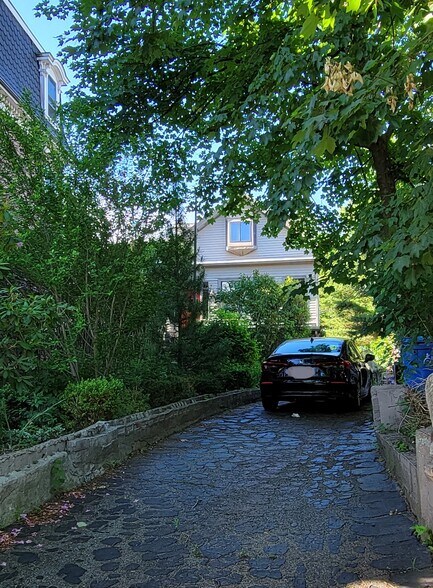 Parking available! House is set back on a nicely planted wooded lot. - 54 Dudley St