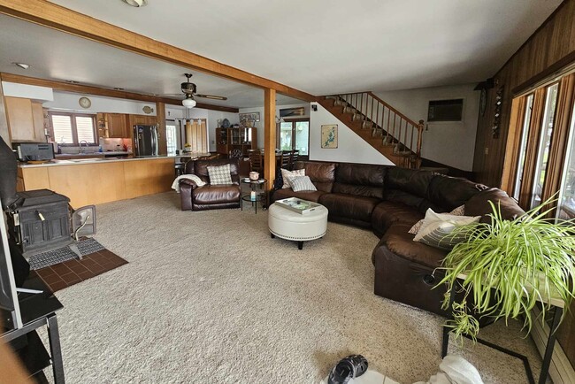 The first floor family room - Big Screen TV is off to side with Fireplace - 2203 Fairview Ave