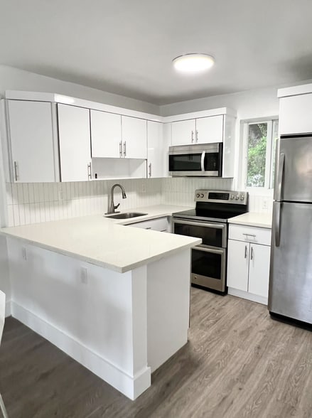 Kitchen with double oven and brand new fridge - 6863 NW 2nd Ave